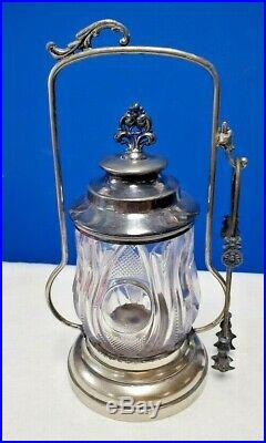 Antique Bullseye glass and metal pickel jar with lid, handle with tongs circa 1890