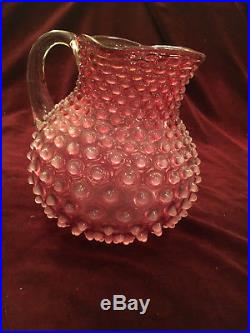 Cranberry Glass Hobnail Fenton Jar, 7 7/8 tall with clear handle