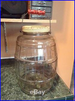 Large antique glass general store wood handle pickle jar