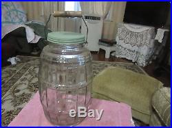 Large antique glass general store wood handle pickle jar 15 inch tall