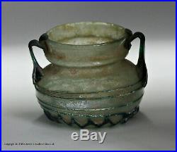 Small Roman pale blue twin-handled glass jar