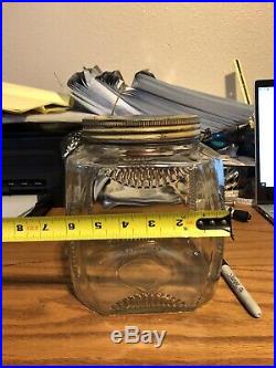 Very Old Square Glass Jar With a Wire and Wood Handle and a Tin Screw Lid