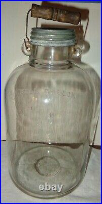 Vintage Clear Round Glass Full Gallon Jug Jar Wood Handle Ball Zinc Cap LID
